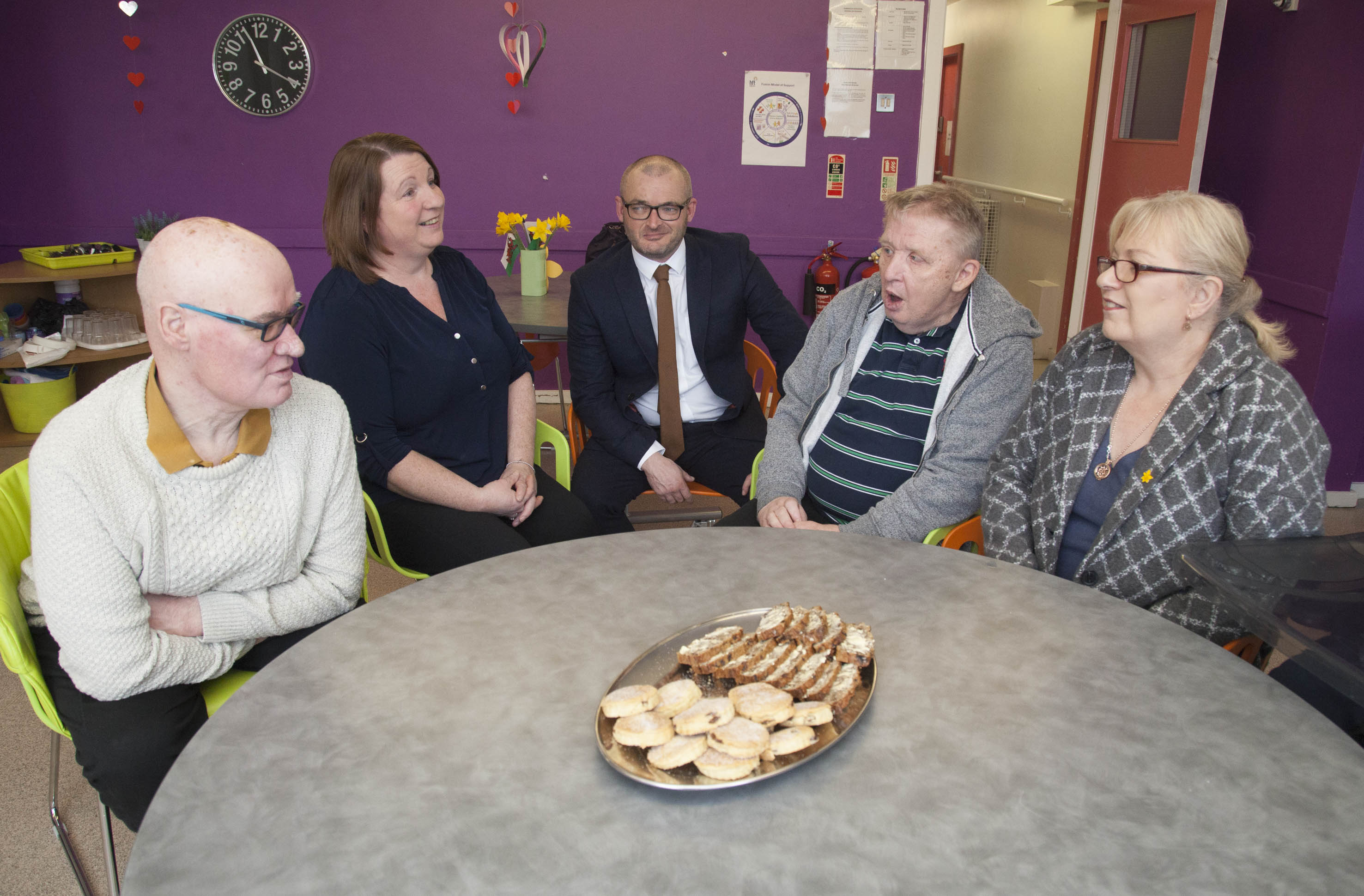 Cllr Christine Jones and Leader of the Council Cllr Aaron Shotton talk to service users Michael Hodson and John Freeman along with Hft's Maria Williams