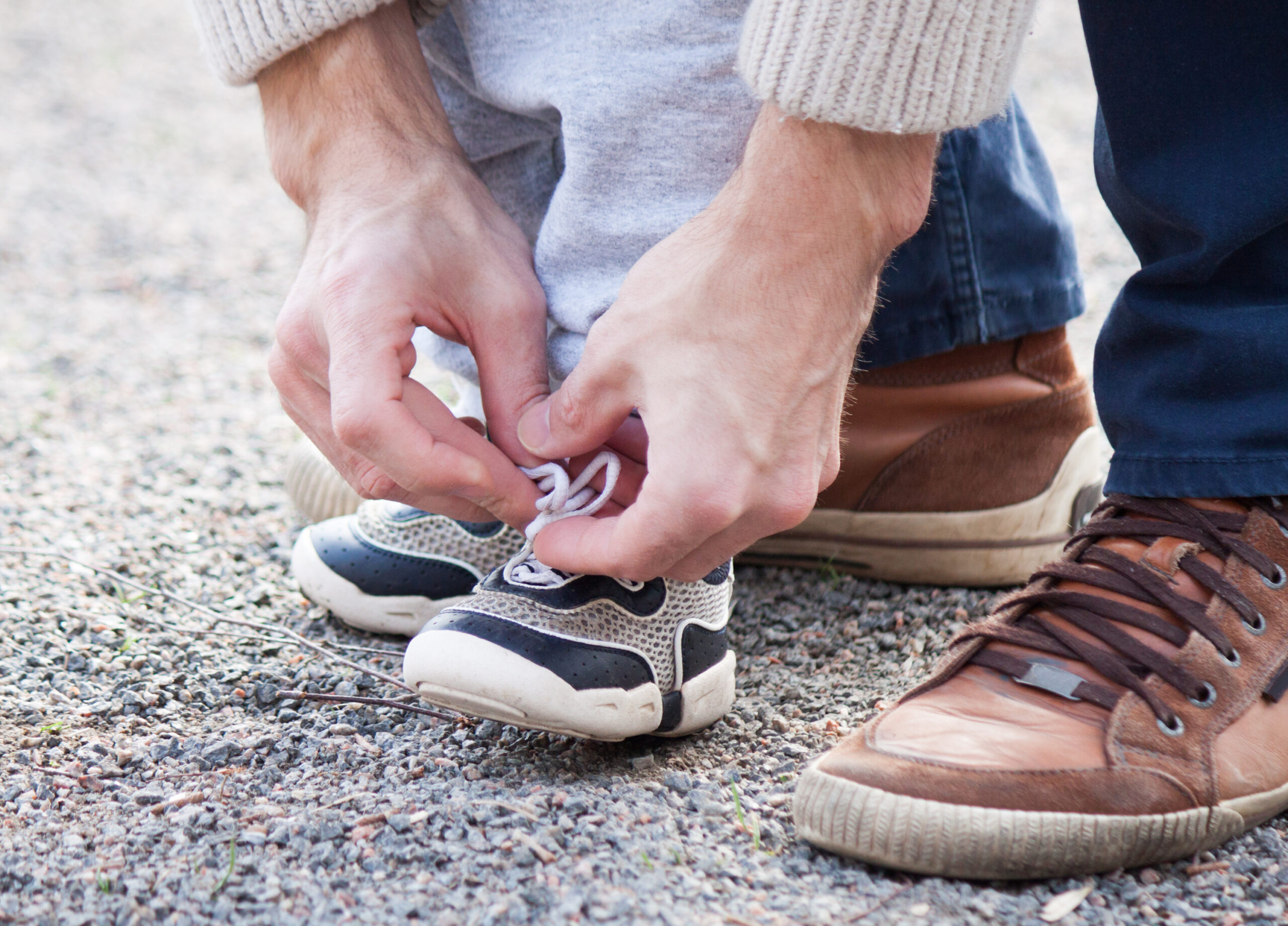 Dad-tying-childs-shoe-lace--scaled (1).jpg