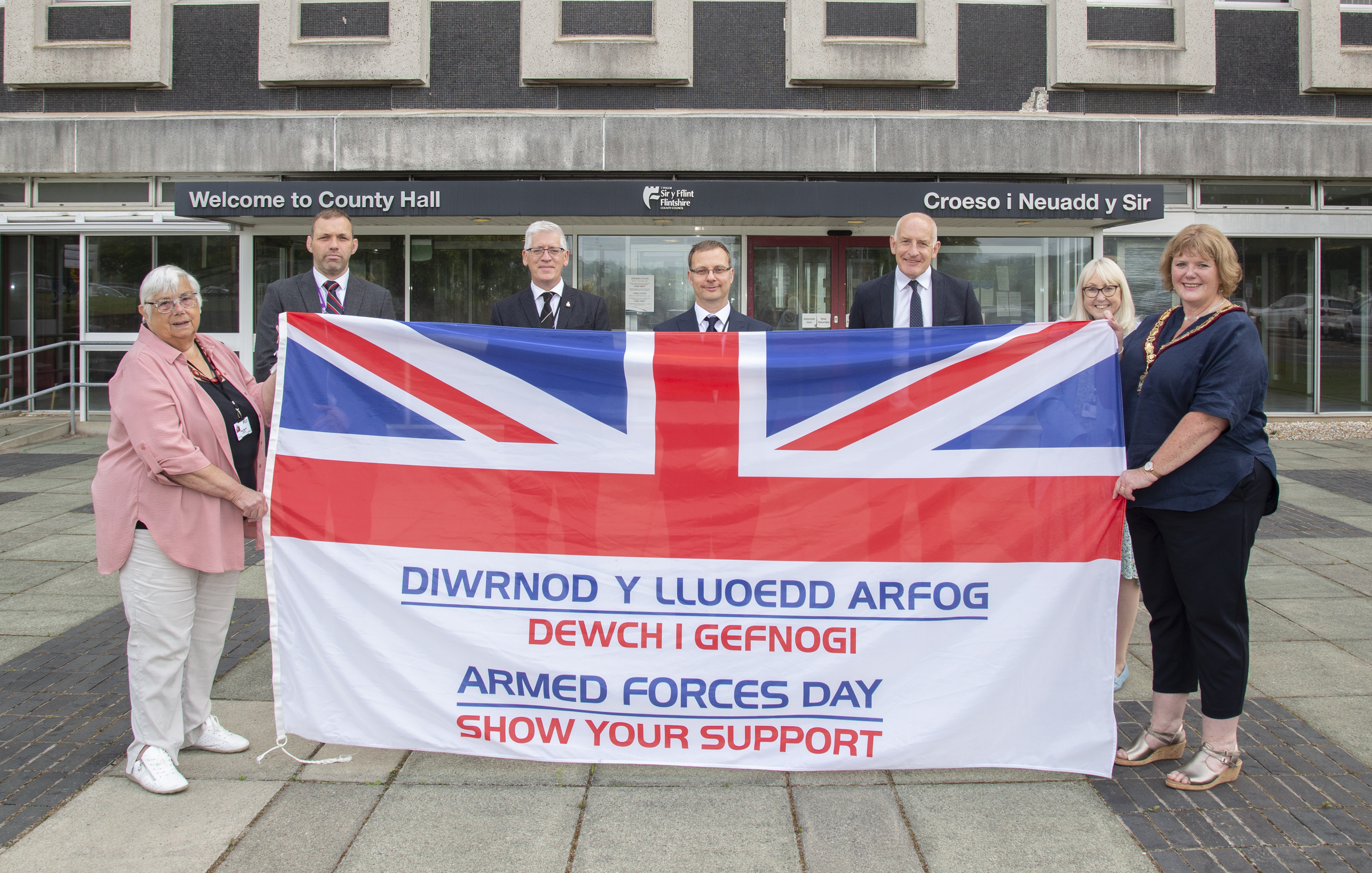 Pictured: FCC's Cllr Hilary Mcguill, Stephen Townley Regional Armed Forces Liason Officer,  Cllr David Evans Armed Forces Champion, Steve Goodrum Democratic Service Manager, Andrew Farrow Chief Officer for Planning, Environment and Economy, Cllr Teresa Carberry and Chair of FCC Cllr Mared Eastwood